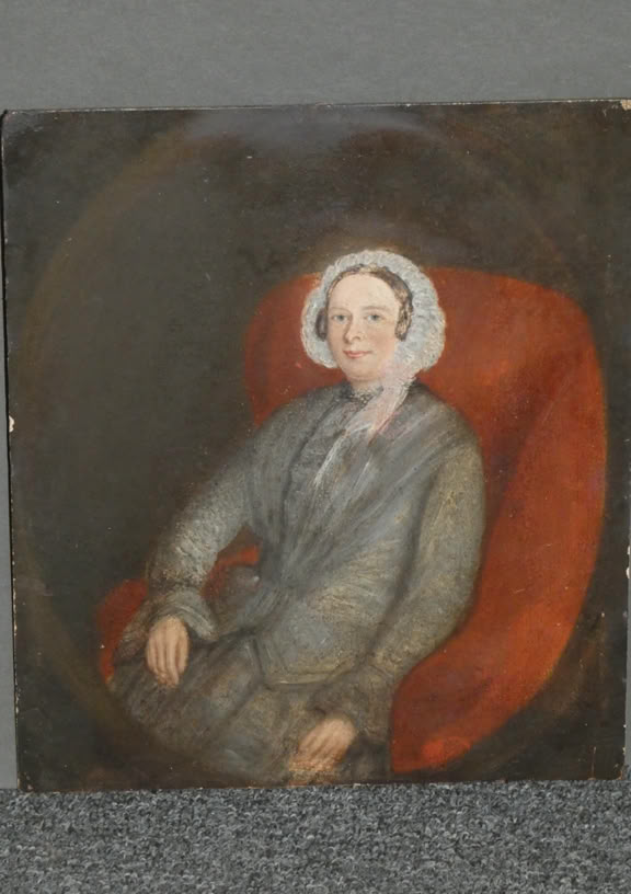 A portrait of a person seated in a red chair, wearing a gray outfit and a white bonnet, with a neutral expression.